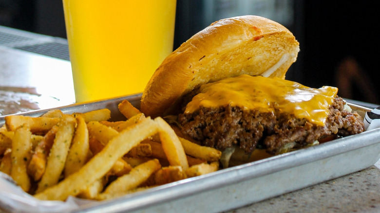 A cheeseburger and fries from AJ Bombers.