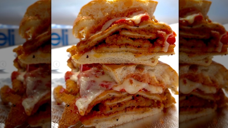 Claudia's chicken parm grinder sandwich cut into two slices