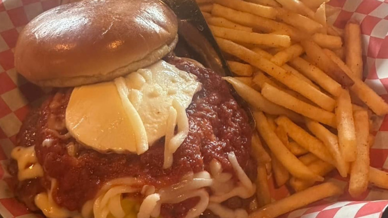 Maggie's chicken parm sandwich with a side of fries