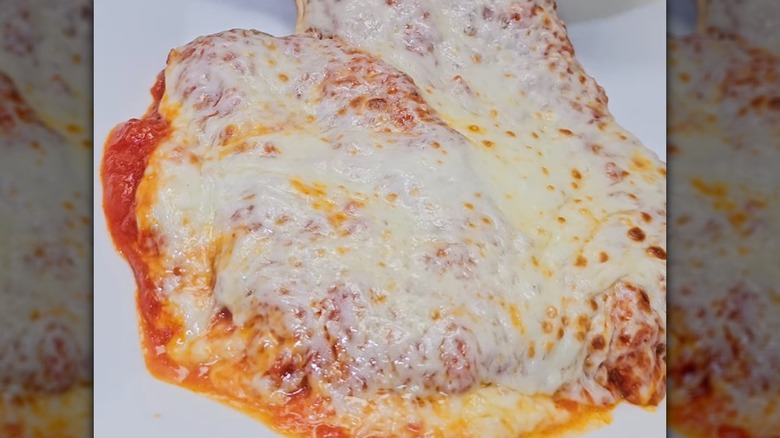 Chef's chicken parm on a white plate