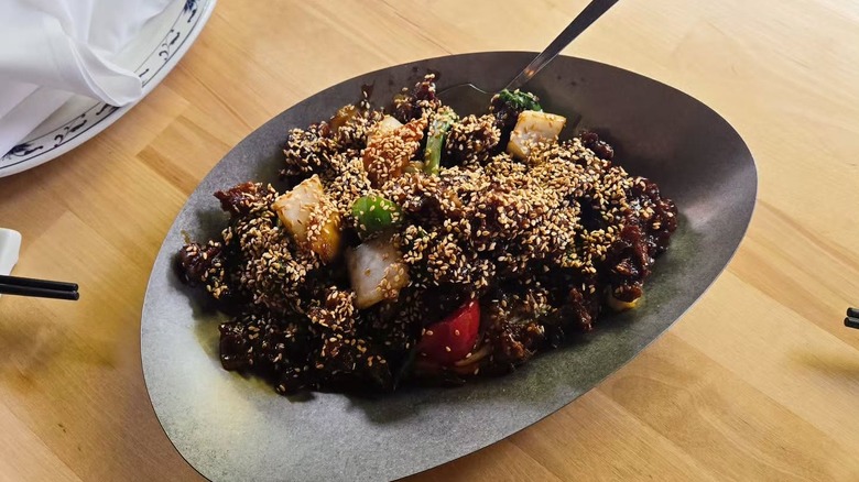 A plate of sesame beef at A Single Pebble in Burlington