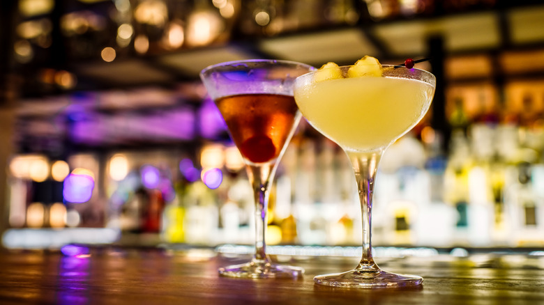 two cocktails on a bar table