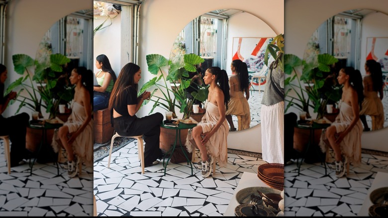Two women drinking at a table in Jurassic Magic