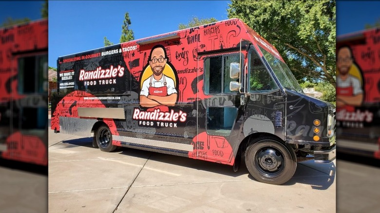 Exterior of Randizzle's Food Truck with blue sky in the background