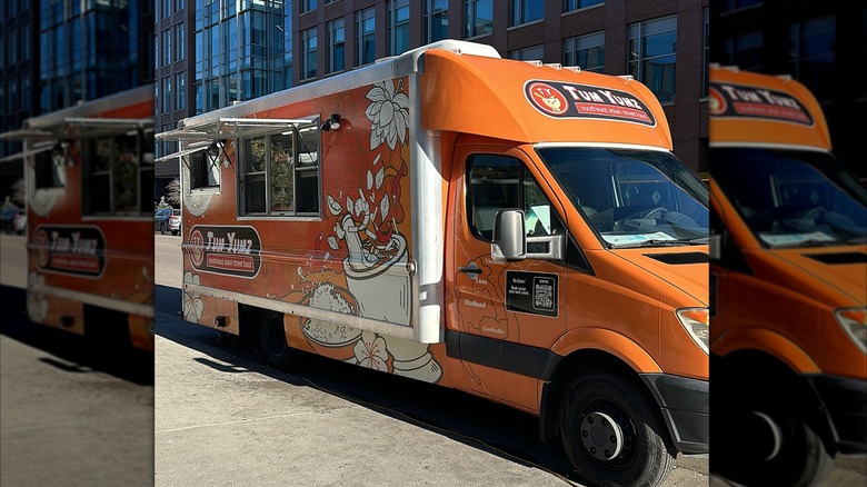 The Orange Tum Yumz truck parked on a city street