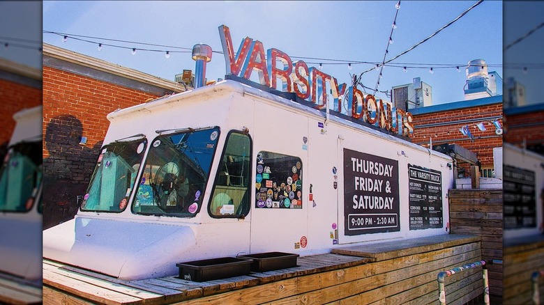 The exterior of The Varsity Truck with string lights overhead