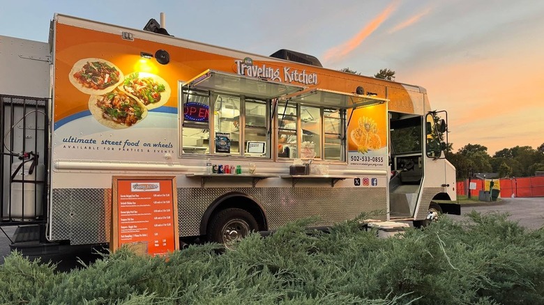 Exterior of The Traveling Kitchen truck at sunset