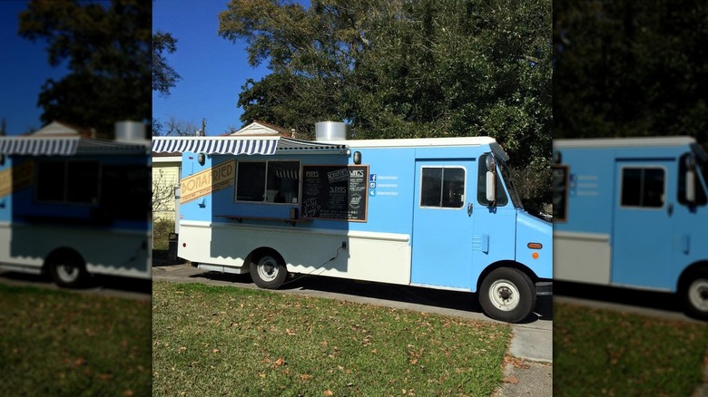 The blue exterior of Bonafried Truck with the awning extended