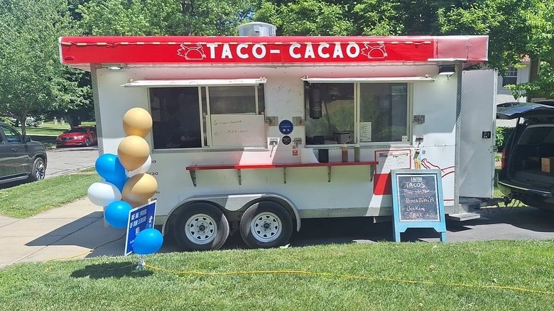 Exterior of Taco Cacao parked in a green space