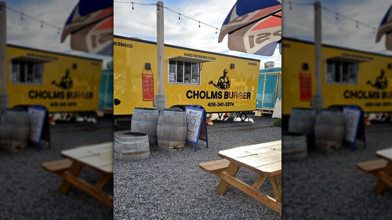 The yellow exterior of Cholms Burger food truck