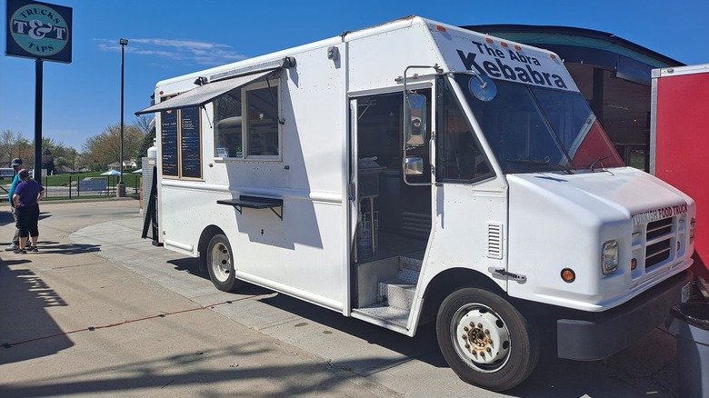 The white exterior of The Abra Kebabra food truck