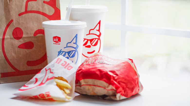 Various wrapped Jack in the Box menu items on a counter