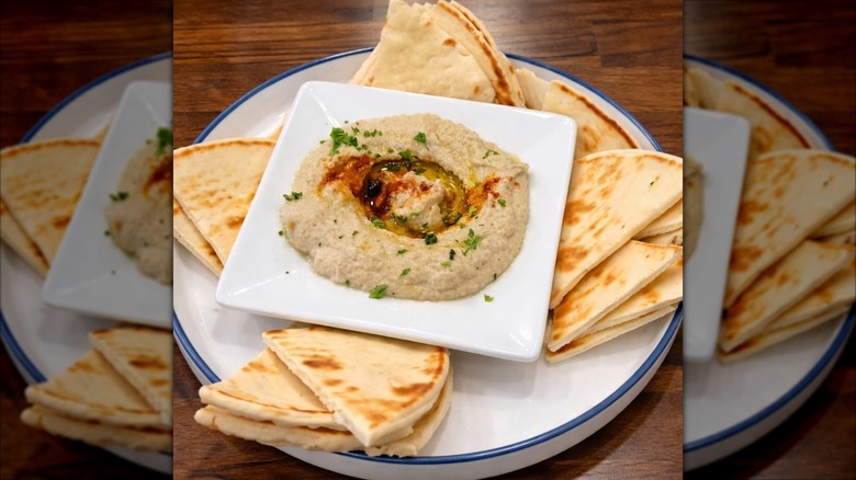 Platter of baba ghanoush with pita bread at The GOAT
