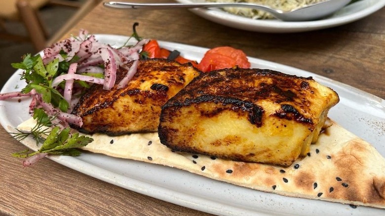 Sea bass with pickled vegetables and pita at Delbar Middle Eastern