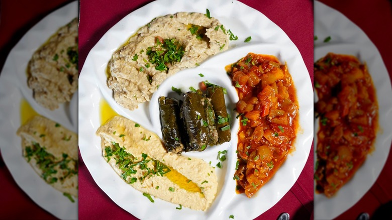 Opa Sampler with hummus, baba ghannoush, stuffed grape leaves, and vegetable medley at Ope The Phoenician
