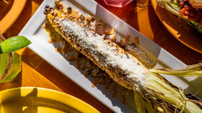 A plate of grilled elote at Cocina Madrigal