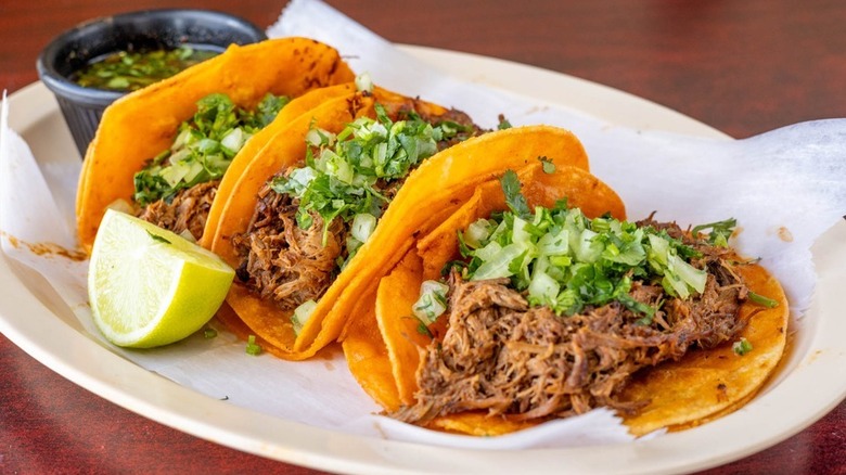 A plate of carnitas tacos at Taqueria El Amigo