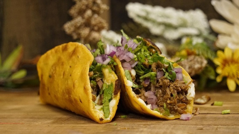 Two birria tacos at La Guelaguetza