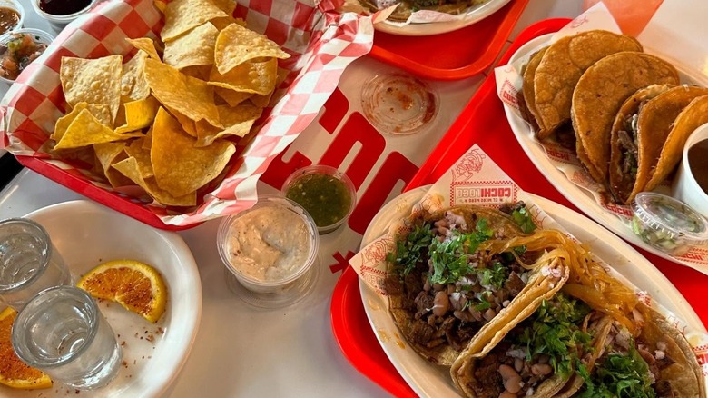 Tequila, tacos, and tortilla chips at Cochiloco