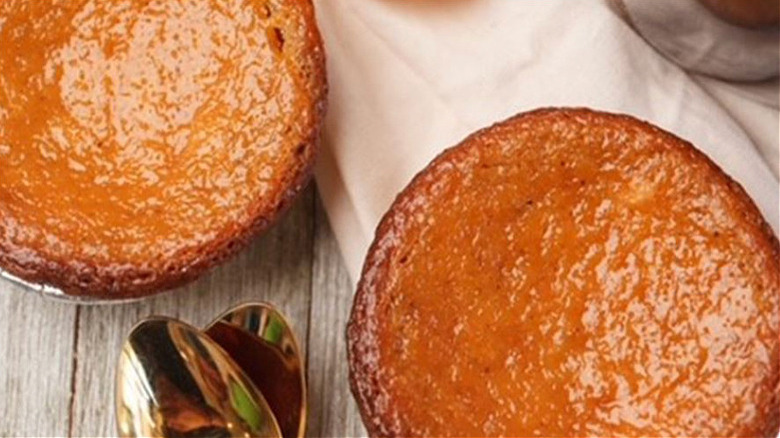 Close up of two whole sweet potato pies