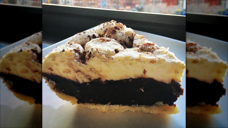 Slice of Lavish Chocolate Cream pie on a white plate