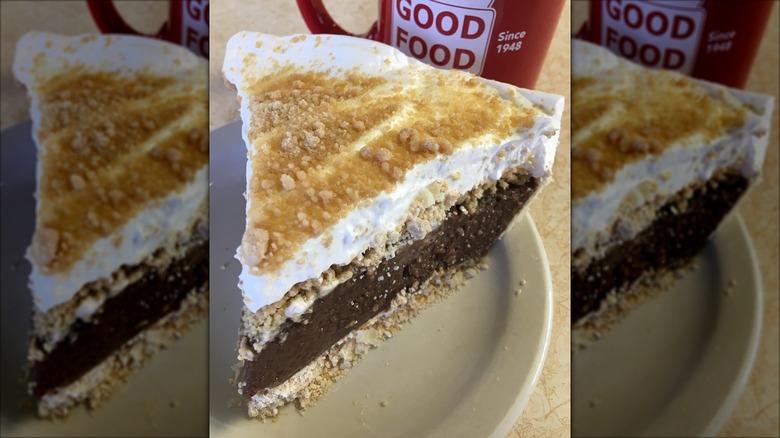 Slice of chocolate peanut butter pie on white plate