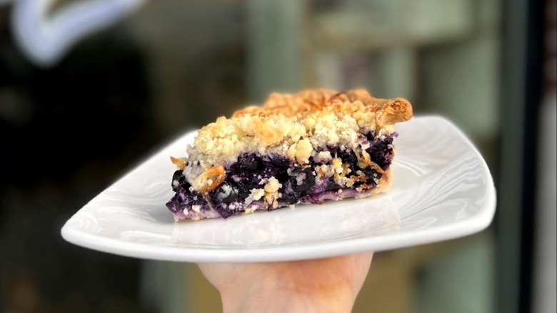 Slice of Blue Hawaiian pie on a white plate