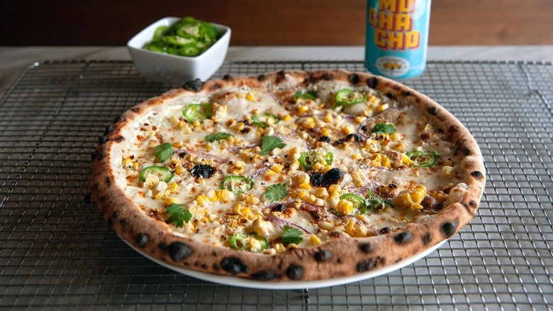 A Mexican Street Corn pizza at Leña