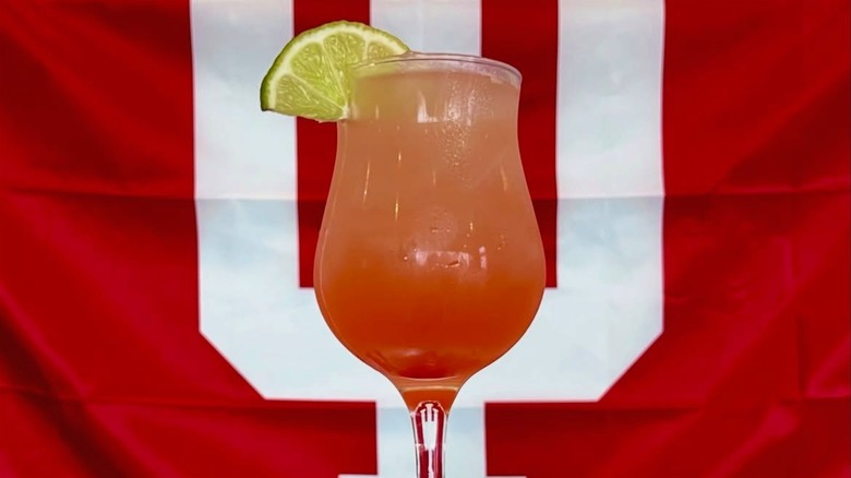 A peach margarita against an IU flag at La Margarita