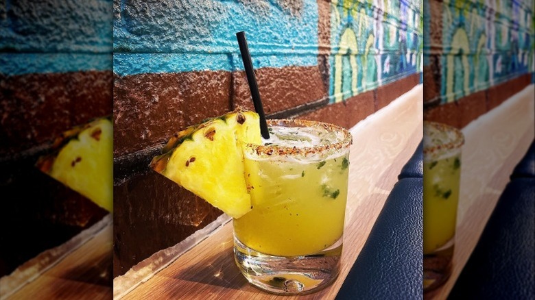 A margarita garnished with a pineapple wedge from Barrio Cocina y Tequileria