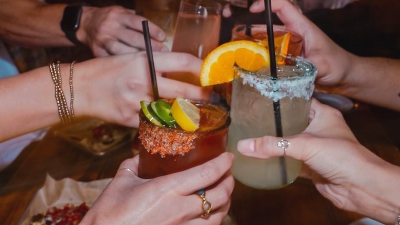 Margarita glasses clink at Mula