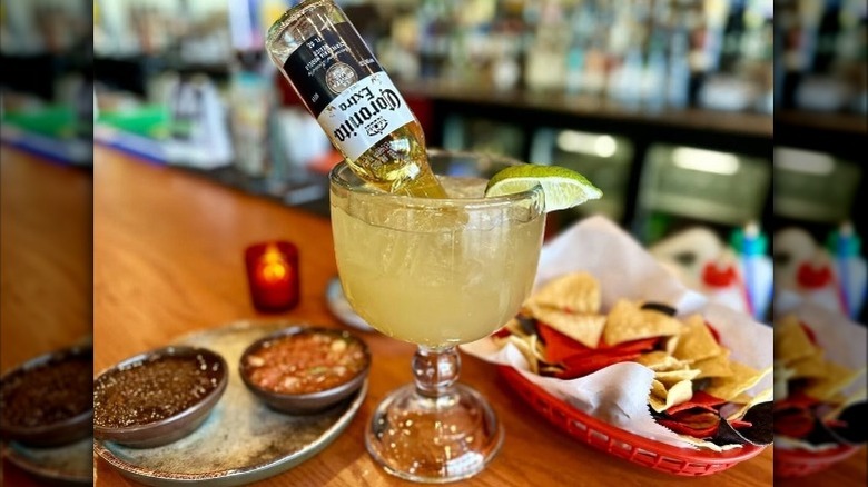 A margarita with a Corona bottle from Hussong's Mexican Cantina
