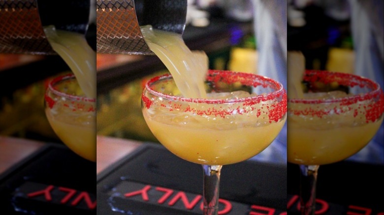 A margarita is poured in a glass at Blue Corn Restaurant