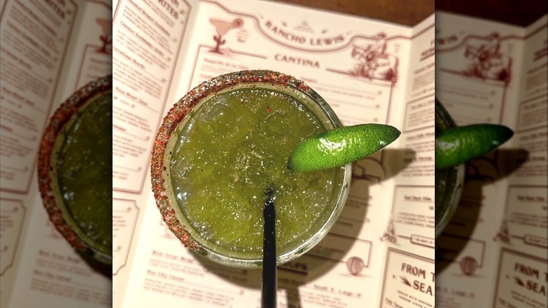 A margarita sits on a menu at Rancho Lewis