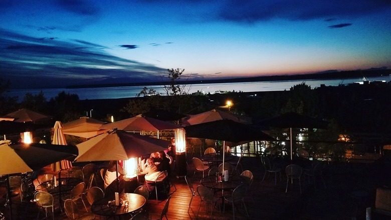 49 State Brewing's outdoor deck at sunset with a view of the harbor