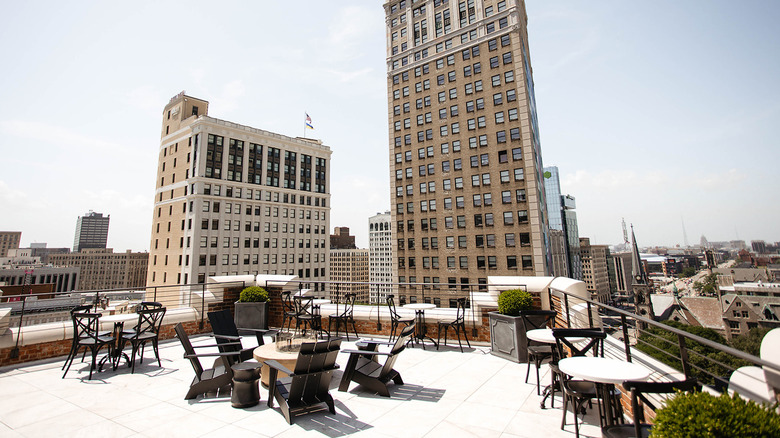 View of the outdoor patio at The Monarch Club surrounded by skyscrapers