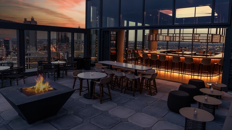 Image showcasing the oudoor terrace and part of the interior bar at Stories on High