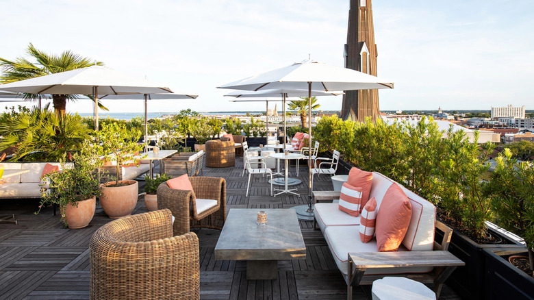 Outdoor patio at Citrus Club with city views in the background