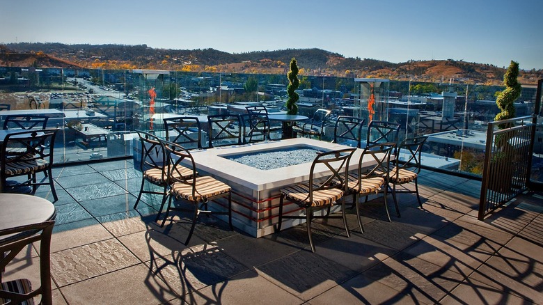 Outdoor space at Juniper at Vertex Skybar with hills in the distance