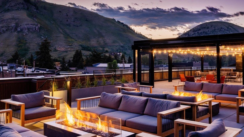 Outdoor patio at The Rooftop at the Cloudveil with mountains in the background