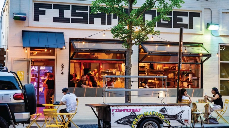 Exterior of Fishmonger with patio tables outside