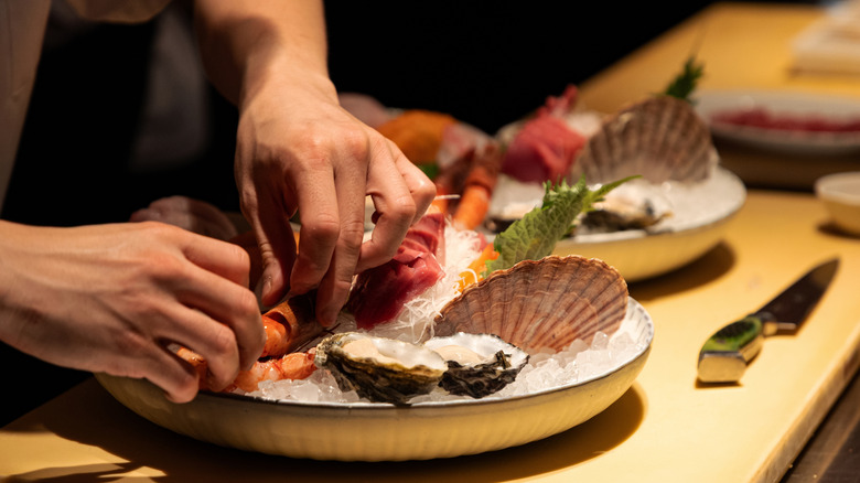 Chef arranging a seafood platter