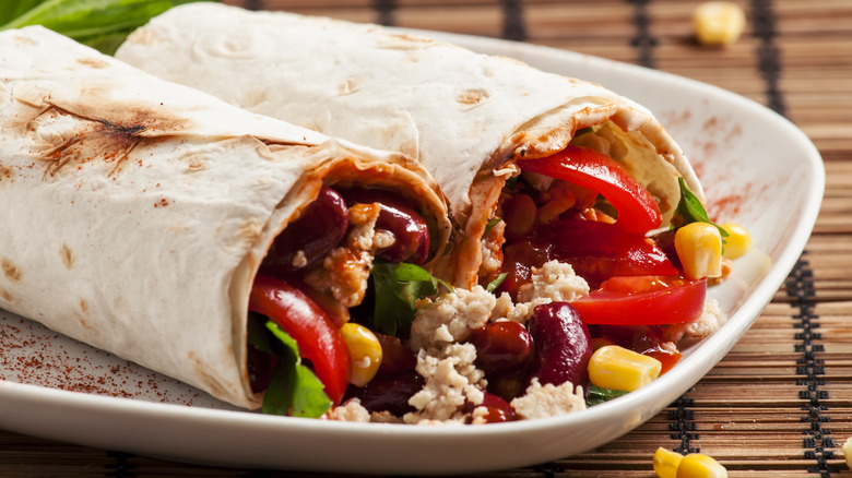 Flour tortillas filled with meat, beans, and vegetablese