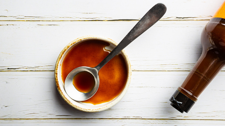 Worcestershire sauce in small dish with spoon