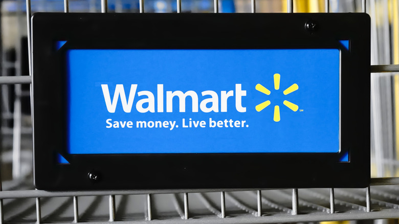 Walmart signage at the front of a grocery cart