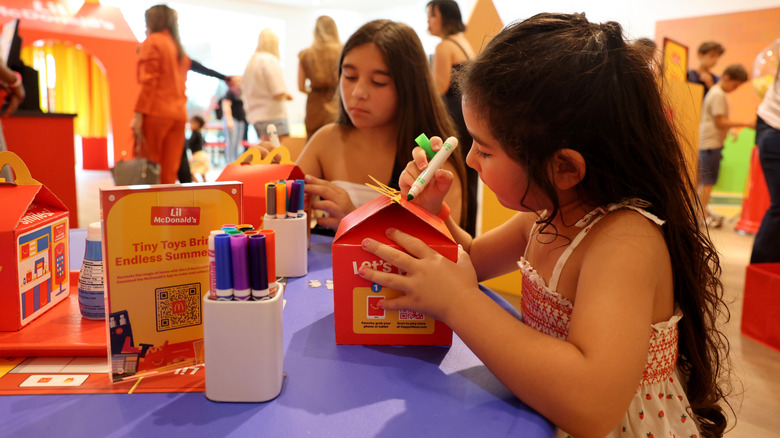 Kids coloring their Happy Meal boxes.