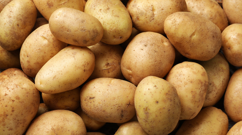 Raw unpeeled potatoes in a heap