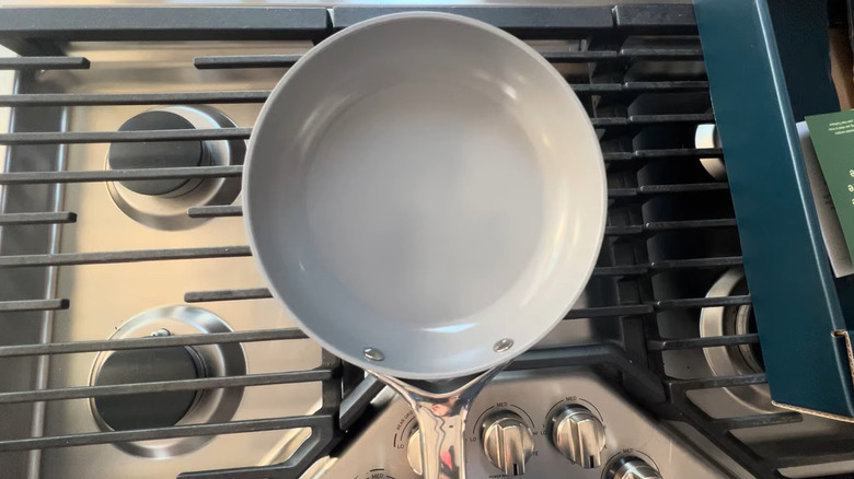 Caraway ceramic-coated nonstick pan over stovetop.