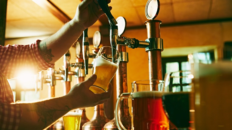 bartender pouring draft beer
