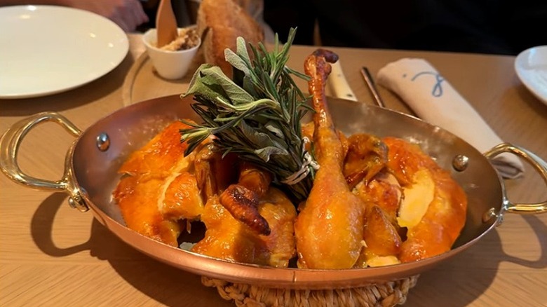 Louise Hong Kong-style chicken in pieces on a plate stuffed with herbs